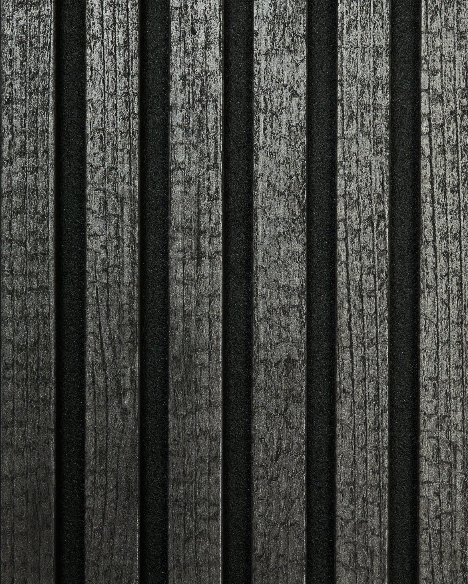 The Rebel | Sample / Charcoal by WoodUpp displays vertical, charred acoustic wood planks with a dark, textured finish for a modern Nordic look.