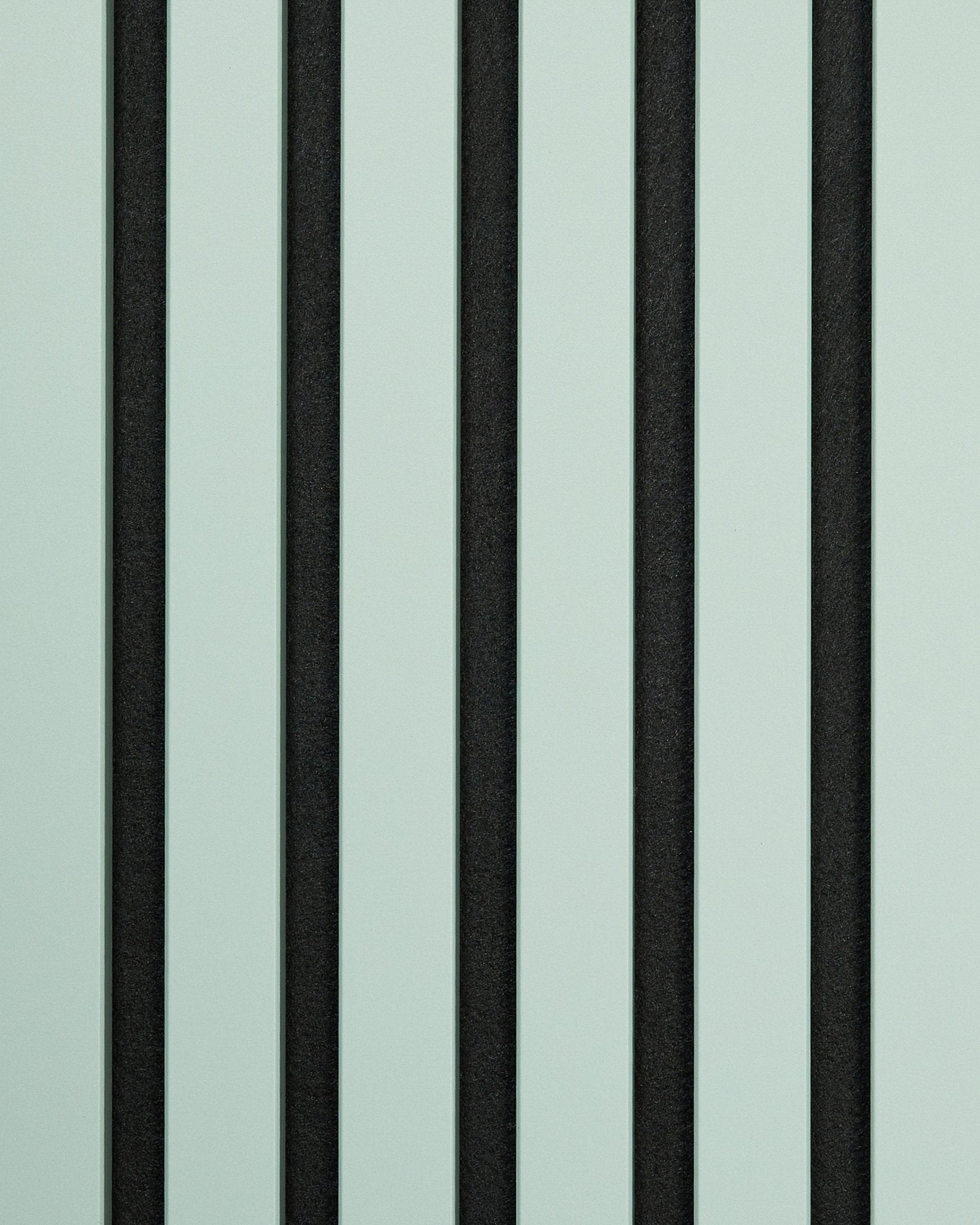 WoodUpp Hue Sample/Cloud acoustic panel displaying vertical alternating black and light green stripes for a bold, simple geometric effect.