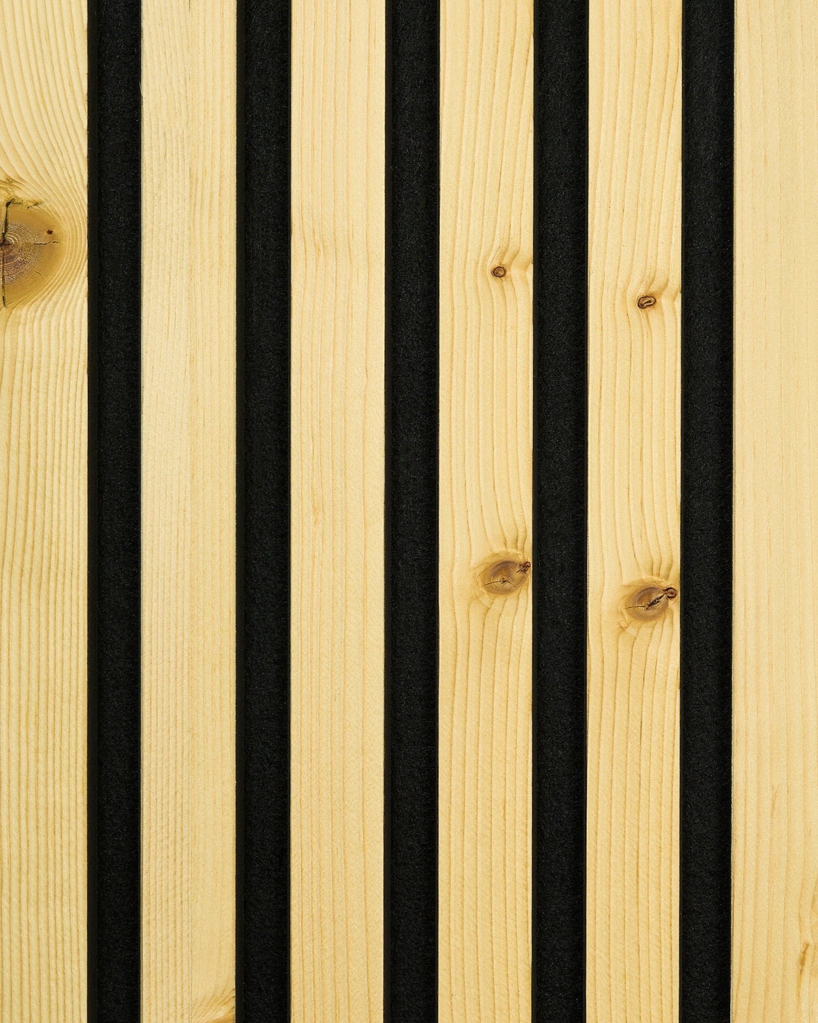 Close-up of WoodUpp Akupanel sample in Rustic Alp finish, featuring vertical black grooves separating light-toned hardwood slats for a Nordic acoustic panel design.