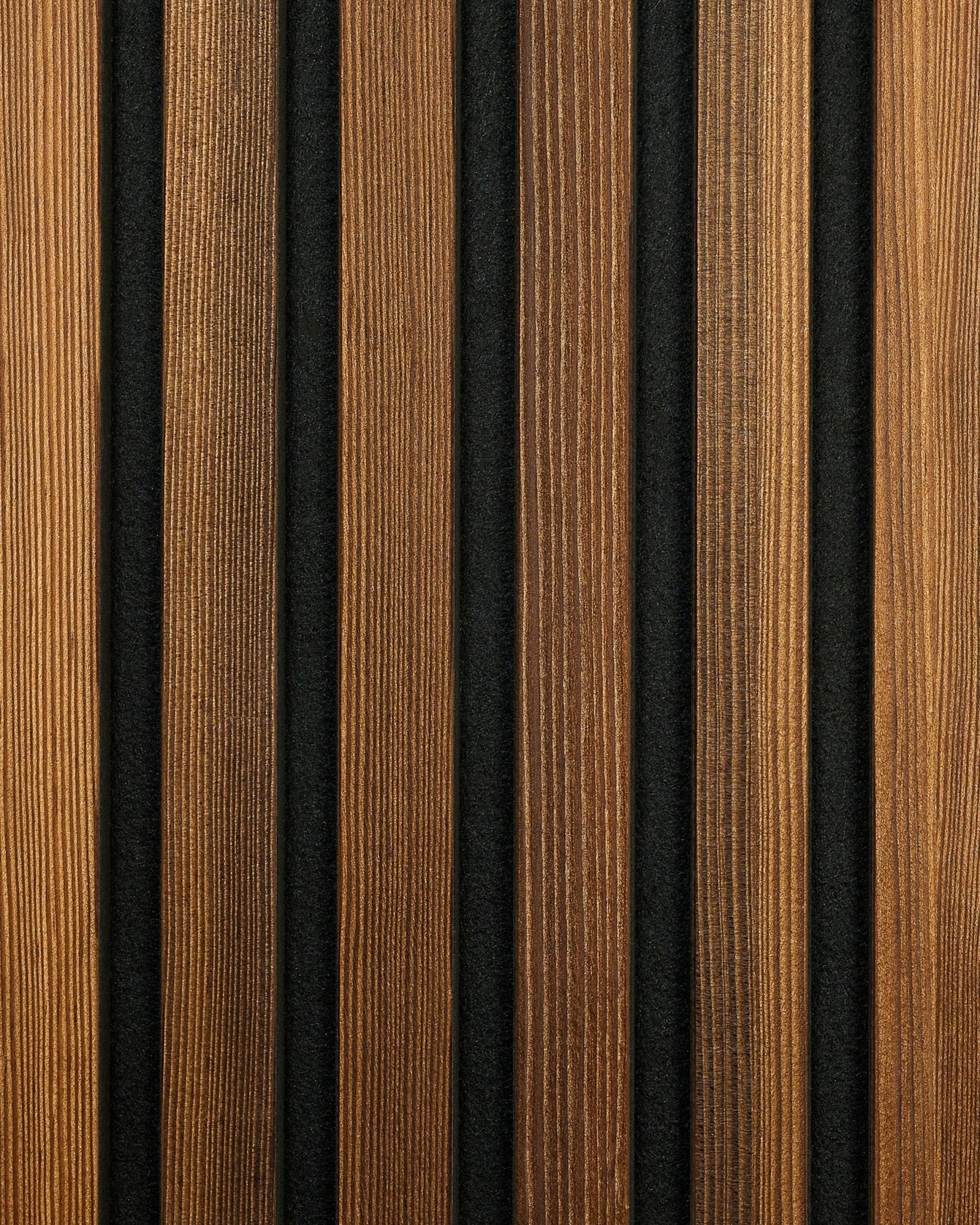 WoodUpp Akupanel Rustic Sample in Smoked Larch, featuring vertical acoustic wood slats with natural grain and black grooves, highlighting a Nordic design.