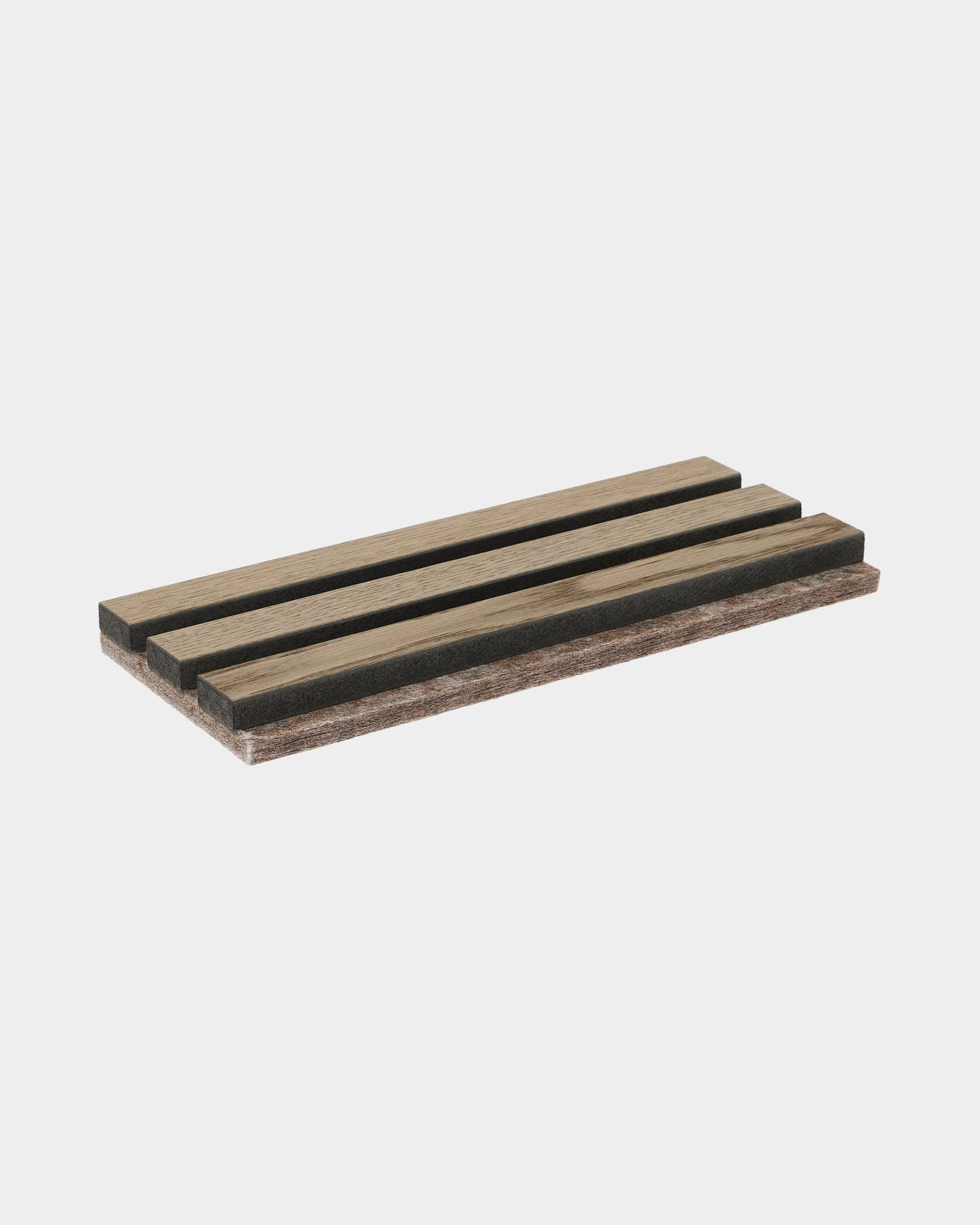 WoodUpp Tonal sample in Grey Oak, a soap dish made with bamboo slats featuring open drainage slots and alternating light and dark wood tones.