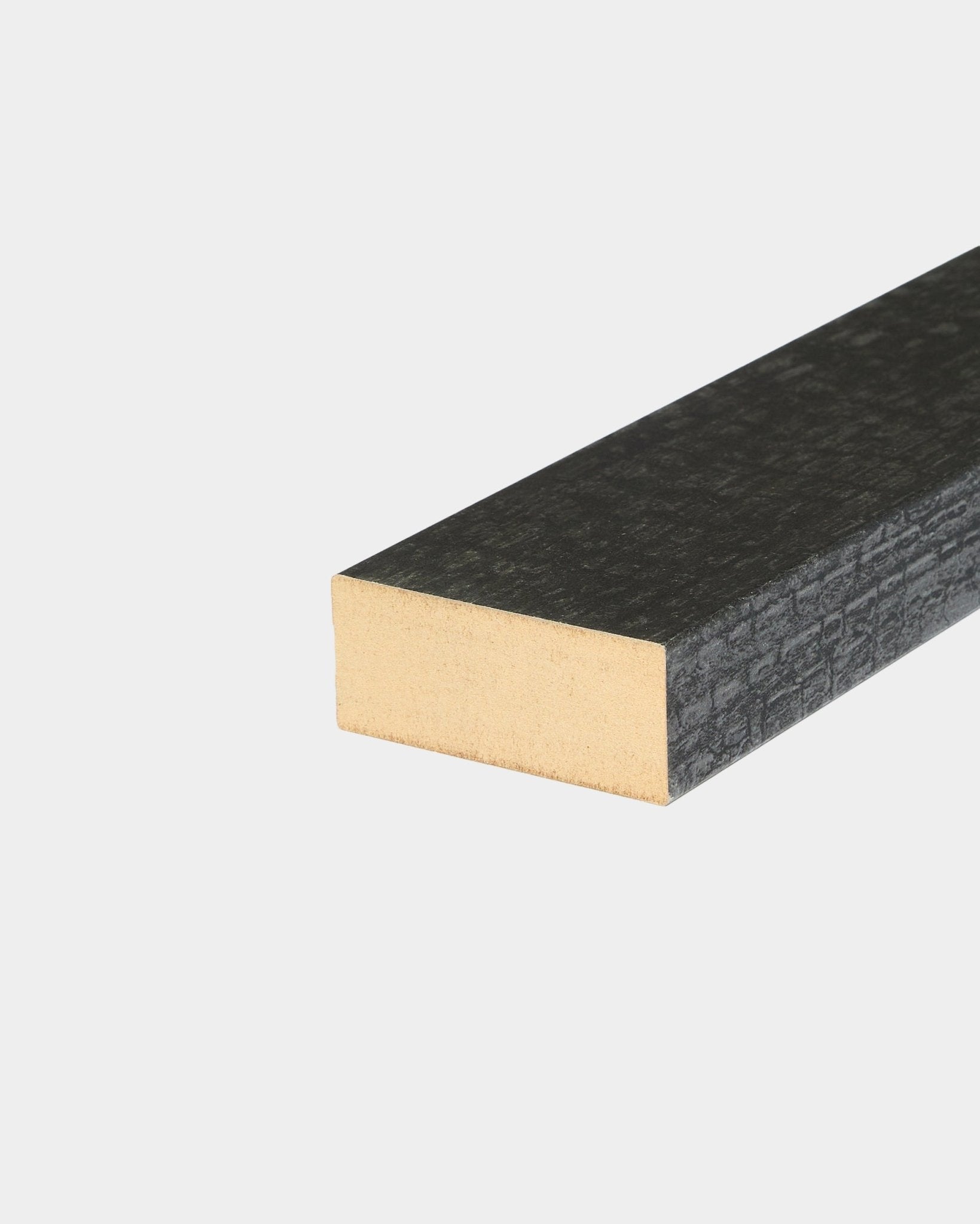 Close-up of WoodUpp Akupanel accessory: End lamella in Charcoal, 6.7 cm, showing textured black wood surface and exposed end grain on a white background.