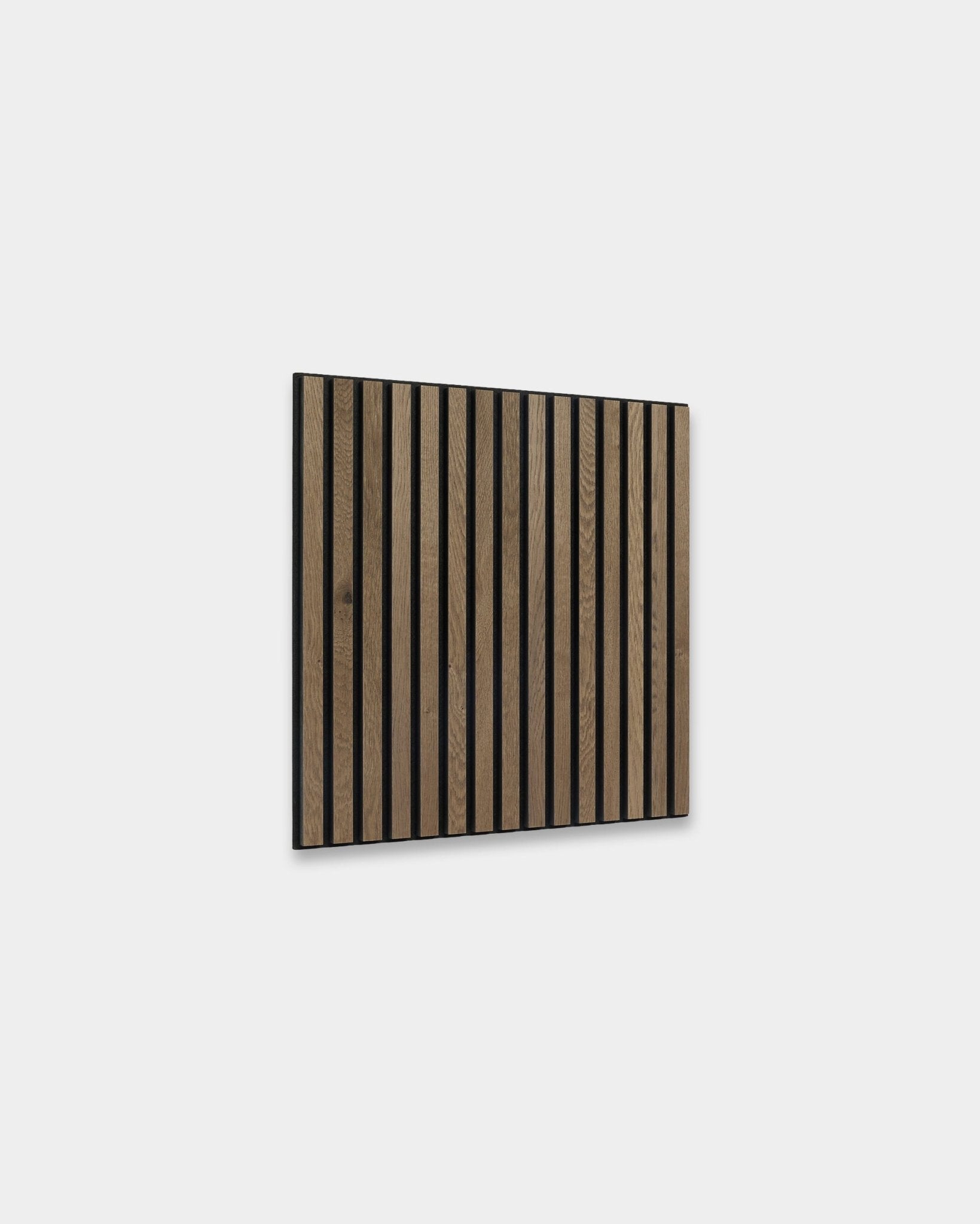 WoodUpp Akupixel acoustic panel in grey oak, 60x60 cm, featuring vertical dark brown slats in Scandinavian style on a light gray wall.