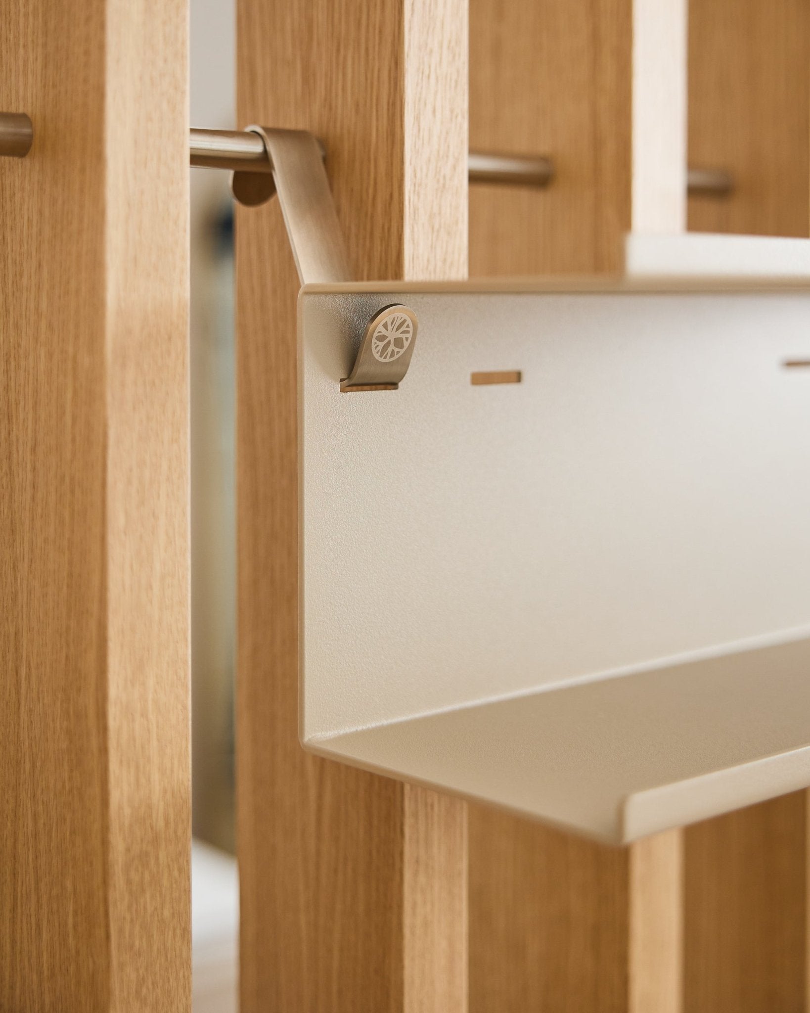 Close-up of the Nell | Double Metal Shelf / BM1 by WoodUpp, a 31.7 cm beige steel shelf with minimalist design mounted on Nordic acoustic wood slatwall panel.
